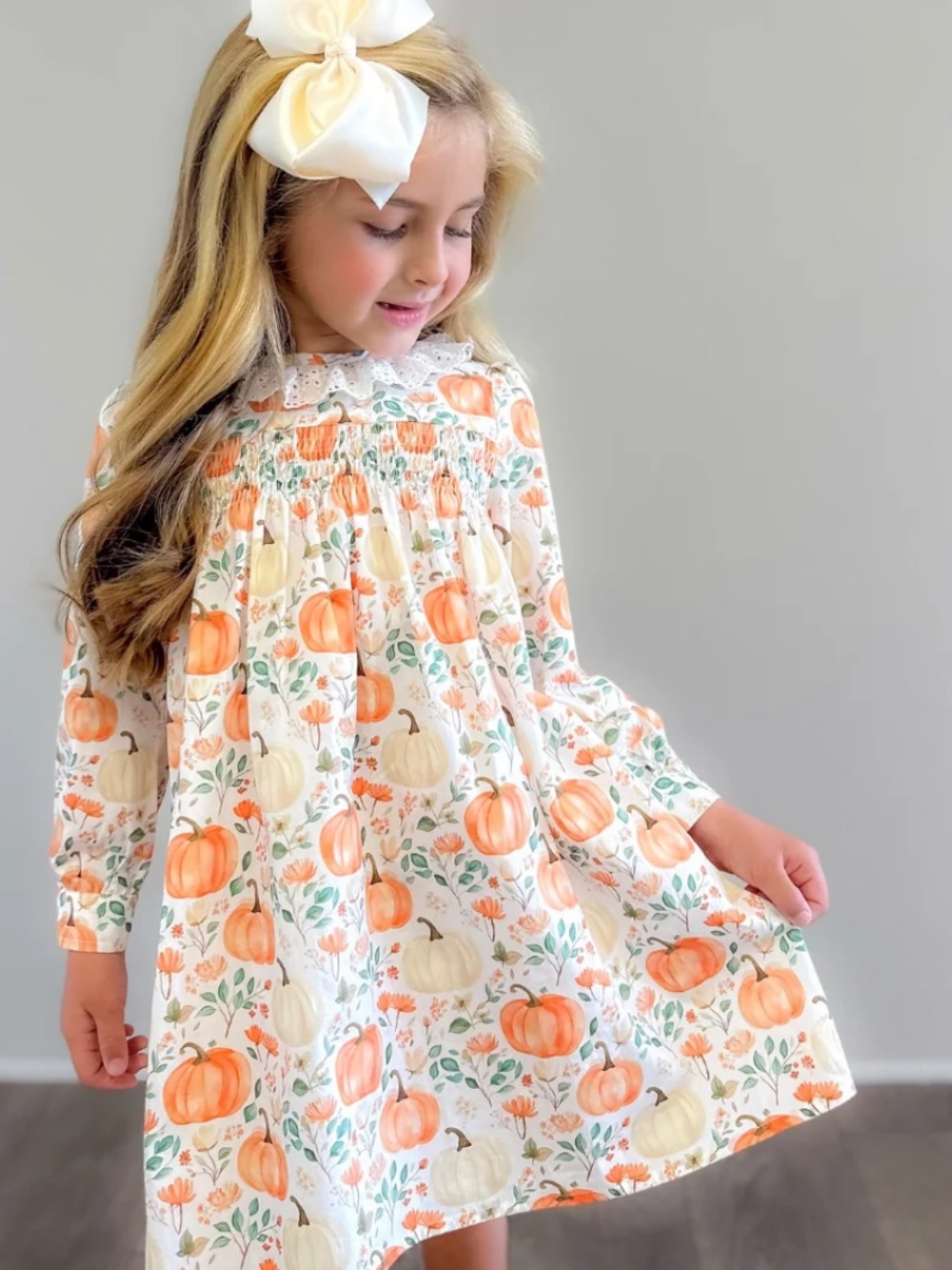 Southern Smocked Co.
EYELET RUFFLE SMOCKED FALL DRESS - AUTUMN PUMPKINS 24M/2T